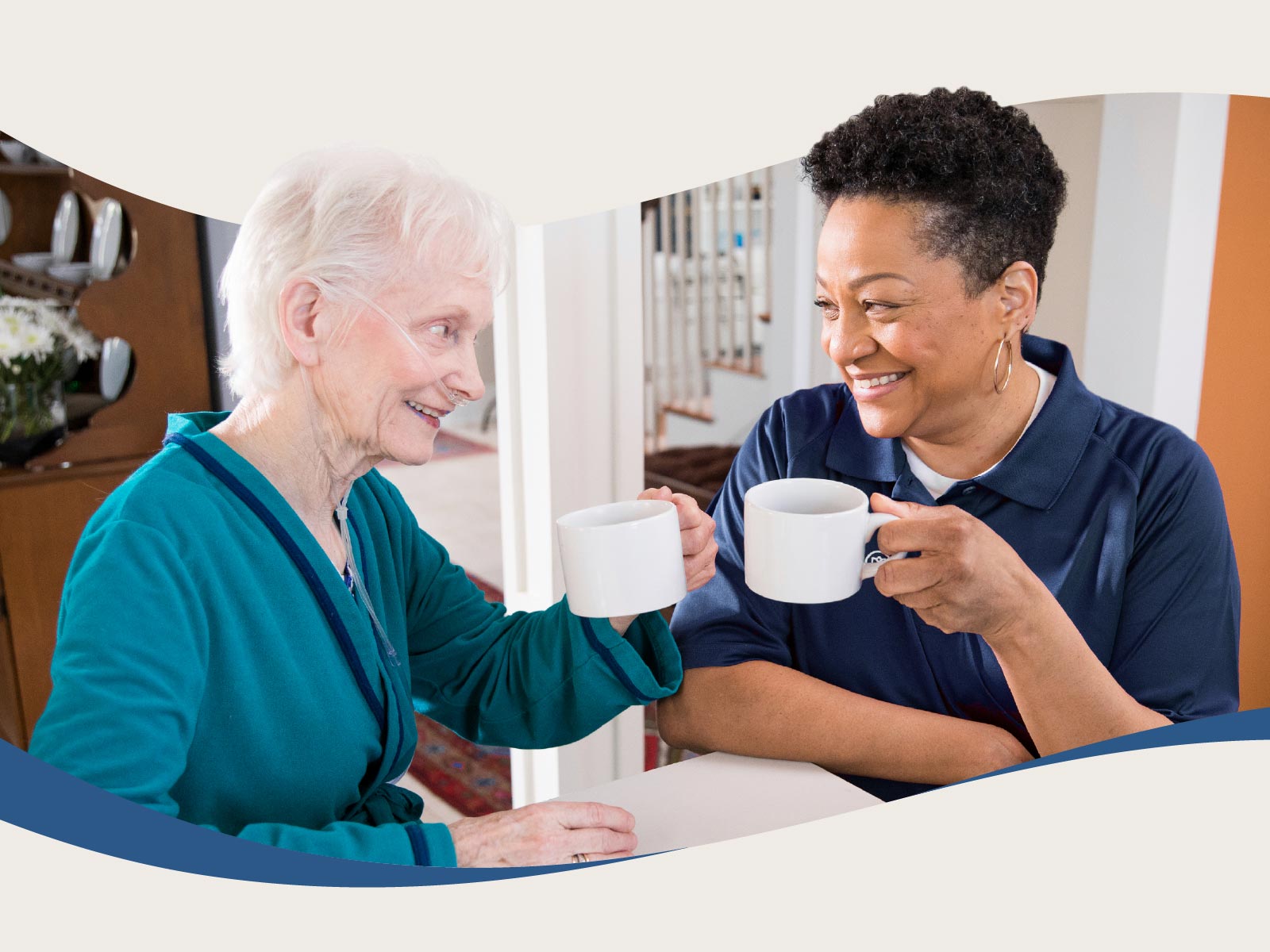 Aging woman and Care Professional smile and enjoy coffee together